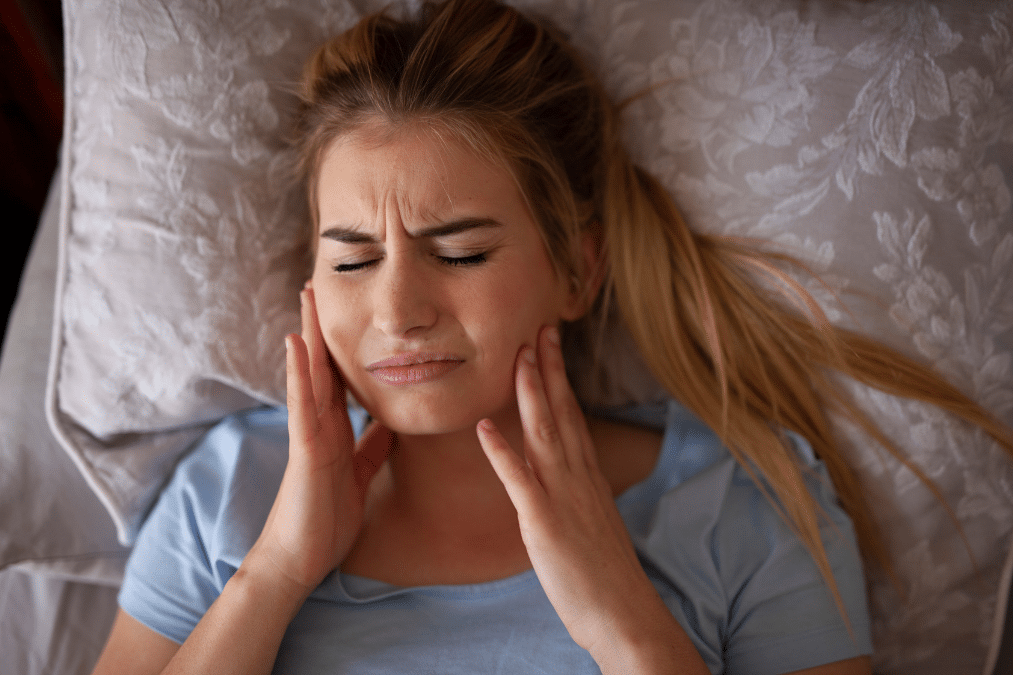 Girl experiencing TMJ pain