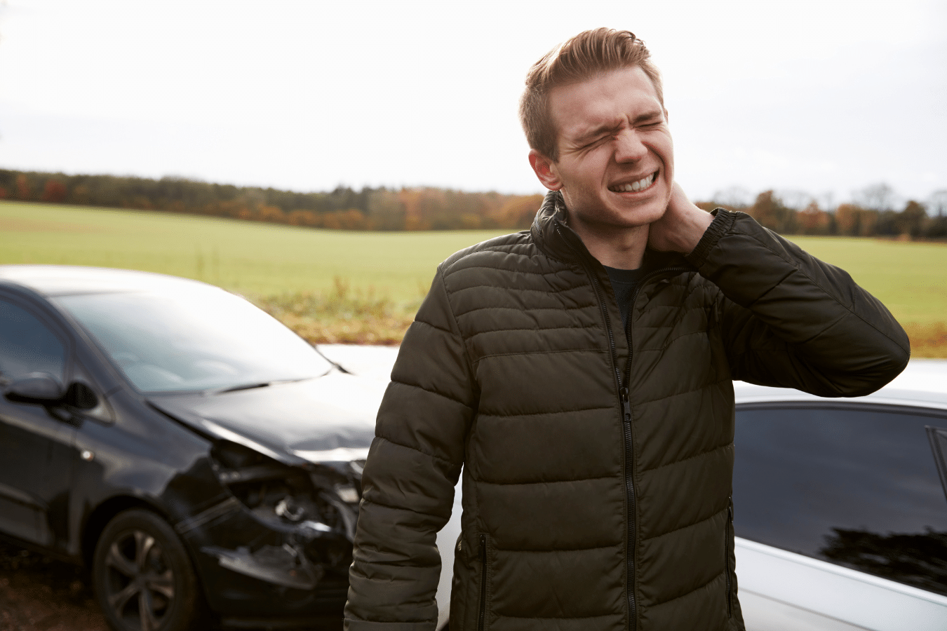 Man holding neck in pain after a car accident