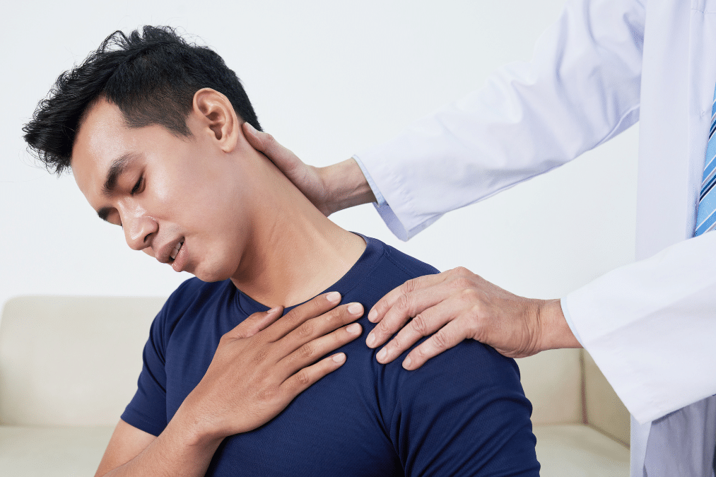Chiropractor gently stretching a patient's neck