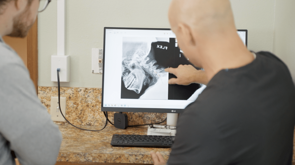 Two people looking at an X Ray